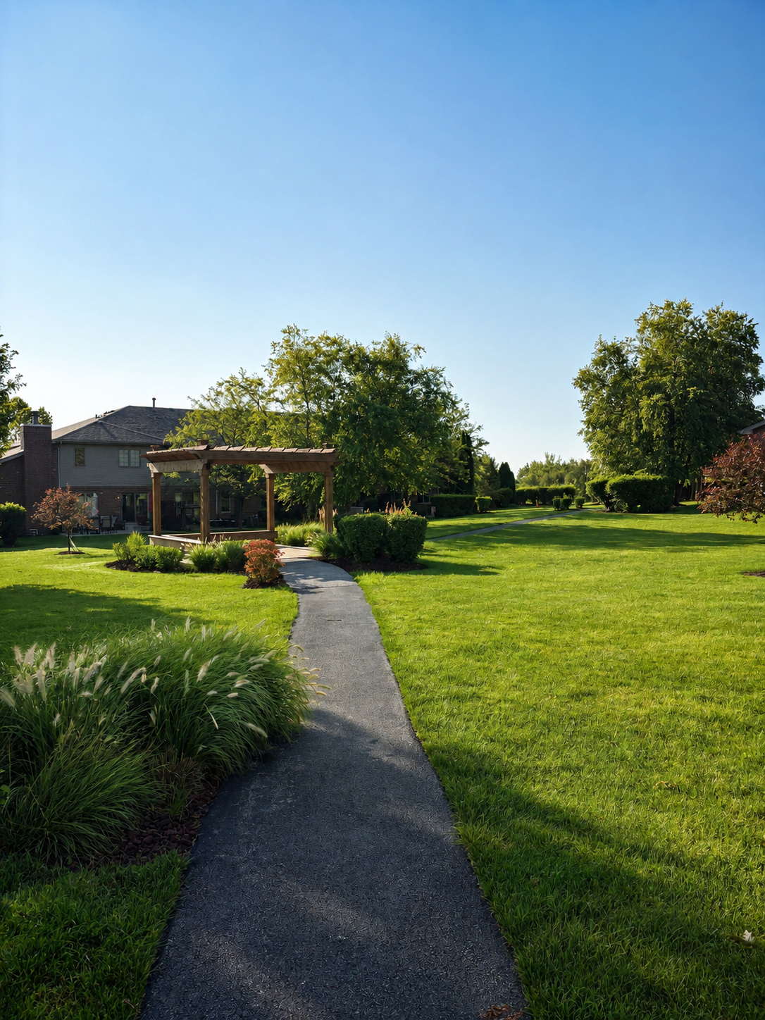 The landscaped pergola and walking path in the Caledonia Meadows community